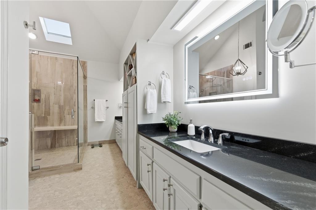 4220 Greentree Lane Southwest Atlanta, GA 30349 - Photo 24 of 42 a bathroom with a double vanity sink and a mirror