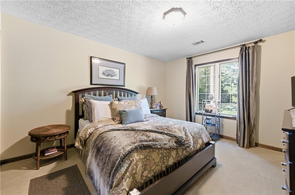 4220 Greentree Lane Southwest Atlanta, GA 30349 - Photo 26 of 42 a bedroom with a bed and a window