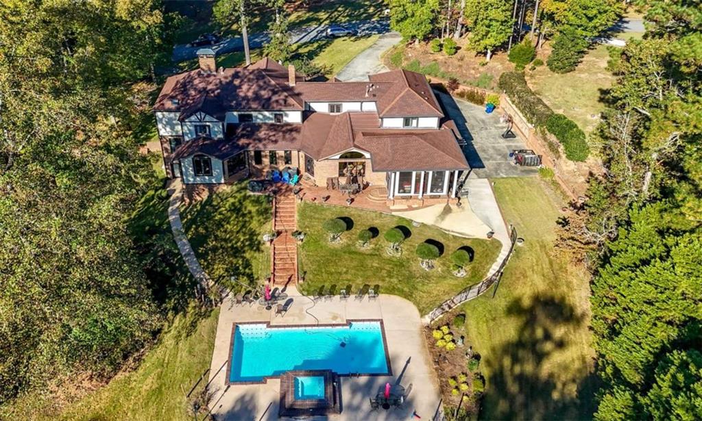 4220 Greentree Lane Southwest Atlanta, GA 30349 - Photo 3 of 42 an aerial view of a house with a yard and garden