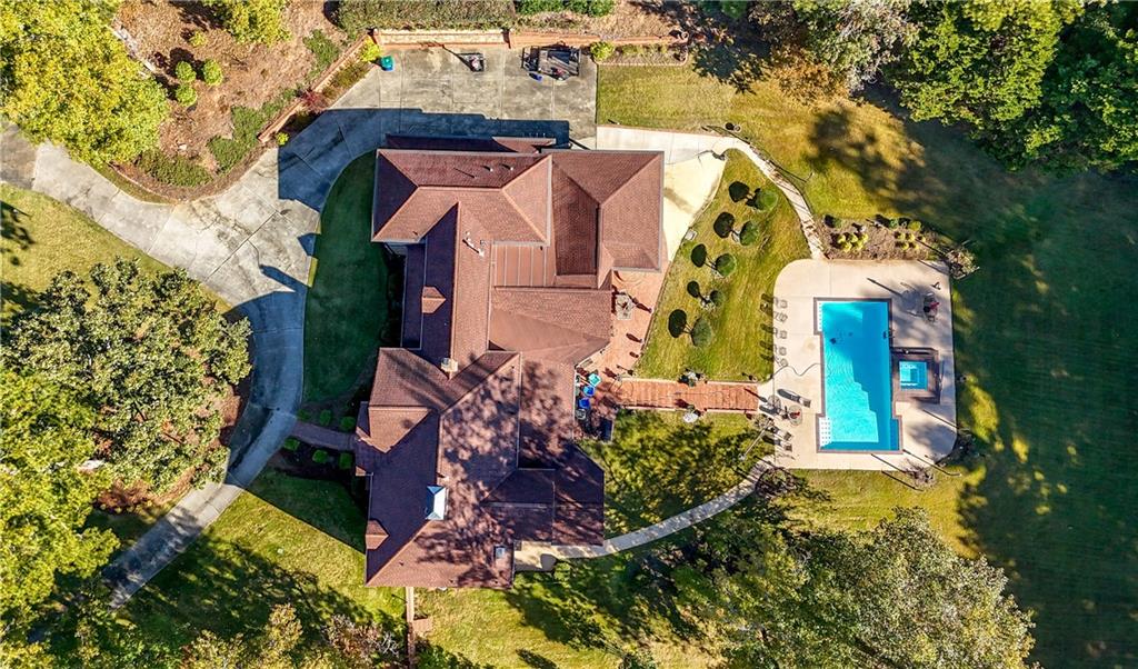 4220 Greentree Lane Southwest Atlanta, GA 30349 - Photo 4 of 42 an aerial view of a house with a yard