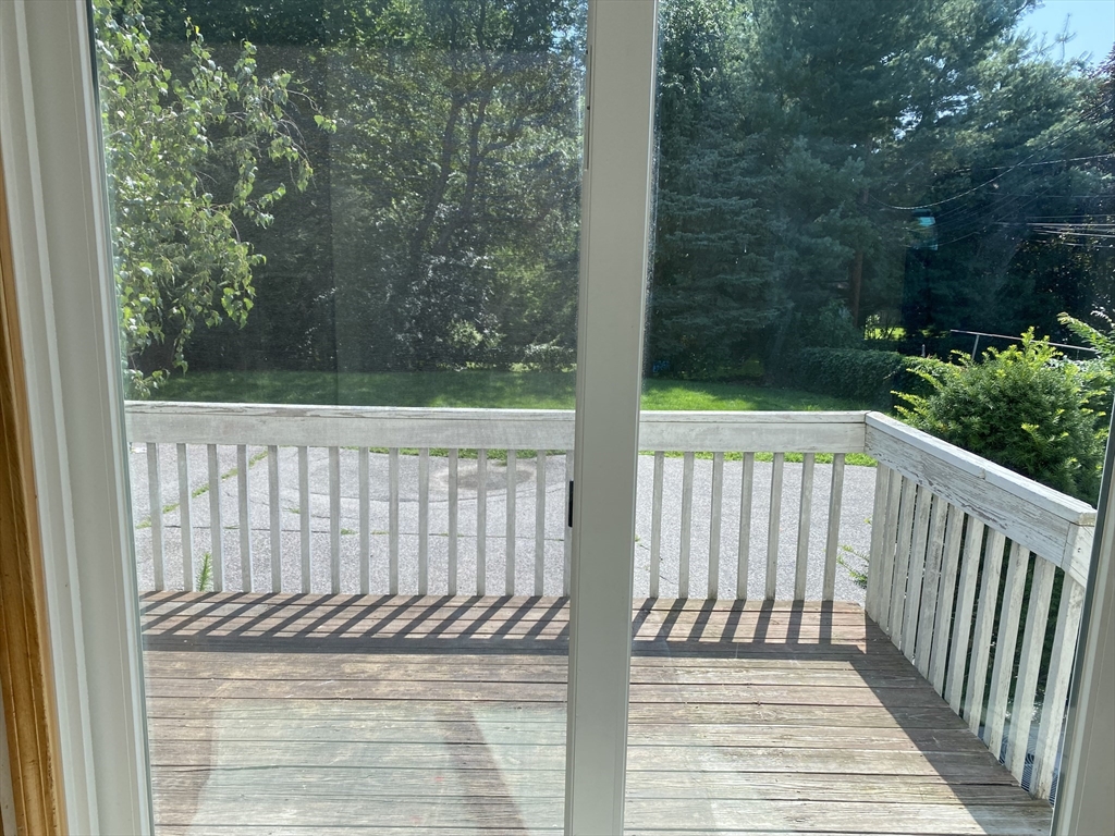 16 Centre Street, Unit 16 Roxbury, MA 02119 - Photo 11 of 14 a view of a wooden balcony