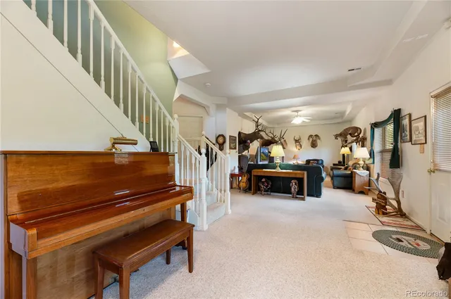 a livingroom with furniture and a flat screen tv