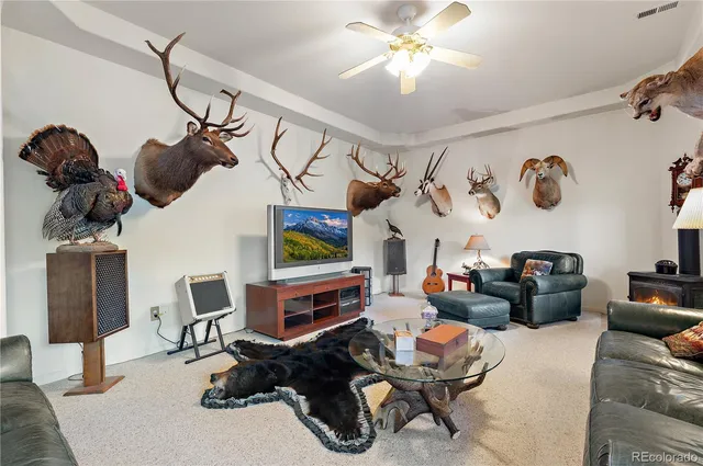 a living room with lots of furniture and air hockey table
