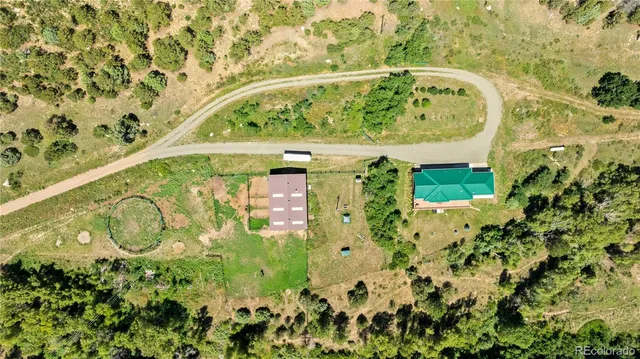 a view of a lush green hillside and houses