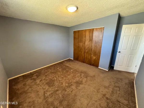 an empty room with a workbench