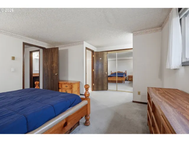 a en suite bathroom with a sink double vanity and a mirror