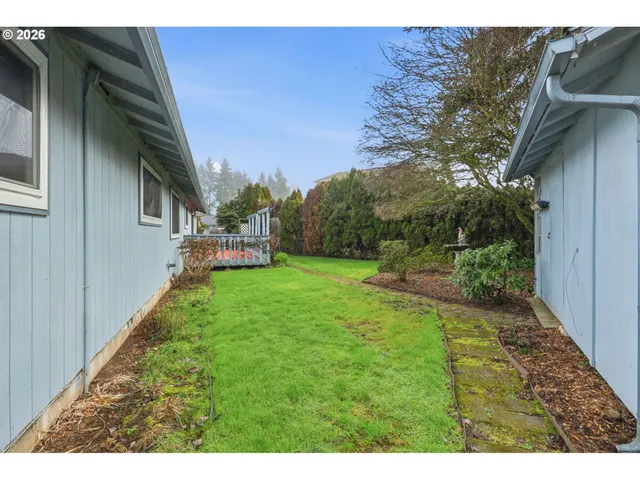 a backyard of a house with lots of green space
