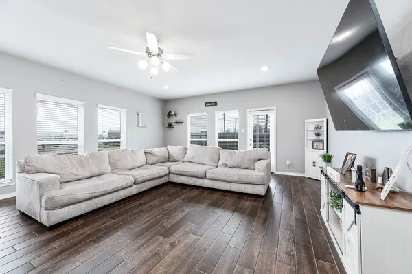 a living room with furniture and a large window