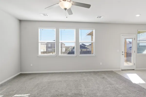 a view of an empty room with a window