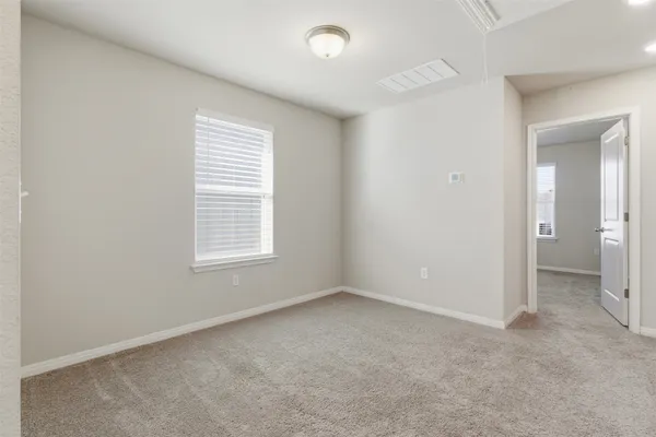 an empty room with a empty space and a window