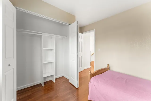 a room with a bed and a window