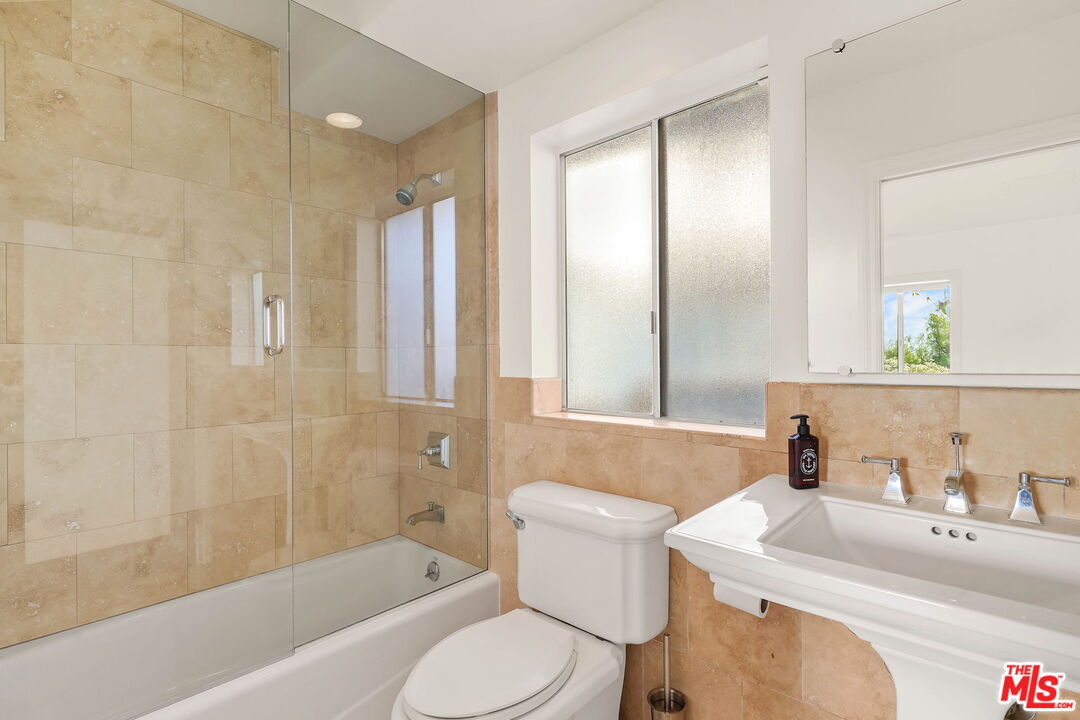 204 Tranquillo Road Pacific Palisades, CA 90272 - Photo 22 of 34 a bathroom with a sink toilet and shower