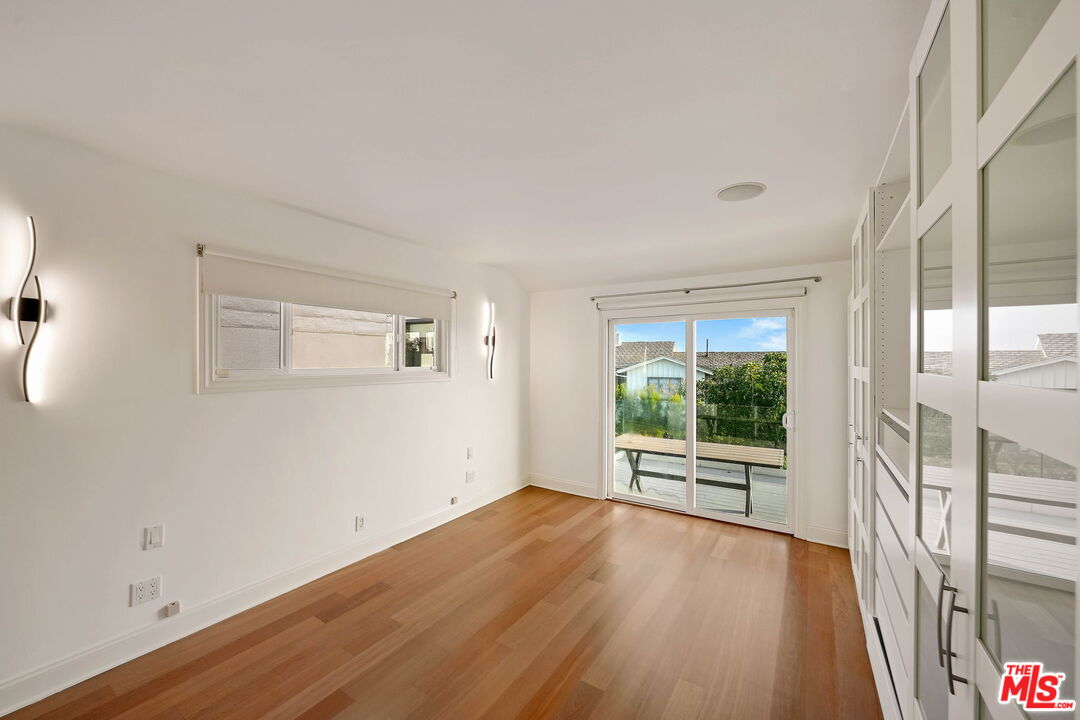 204 Tranquillo Road Pacific Palisades, CA 90272 - Photo 27 of 34 wooden floor in an empty room with a window