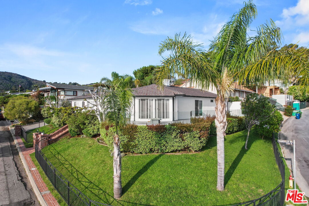204 Tranquillo Road Pacific Palisades, CA 90272 - Photo 8 of 34 a view of a house with a backyard