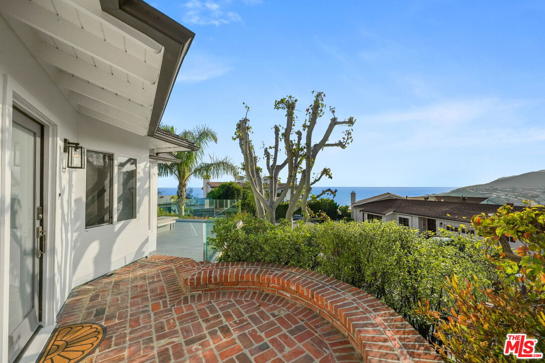 204 Tranquillo Road Pacific Palisades, CA 90272 - Photo 10 of 34 a view of a pathway with a house in the background
