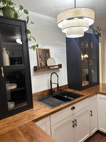 a kitchen with a sink and cabinets