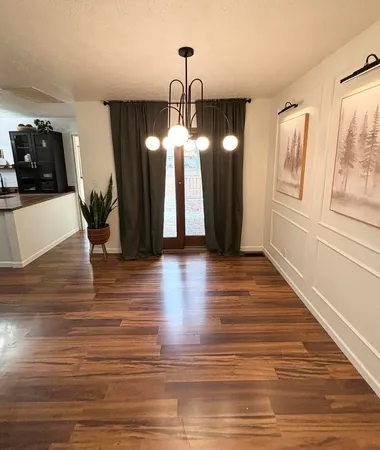 a view of a livingroom with wooden floor