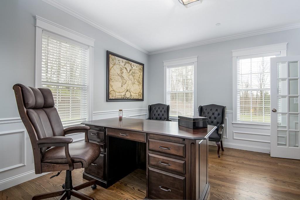222 Sugar Road Bolton, MA 01740 - Photo 15 of 36 a view of a workspace with furniture and a window
