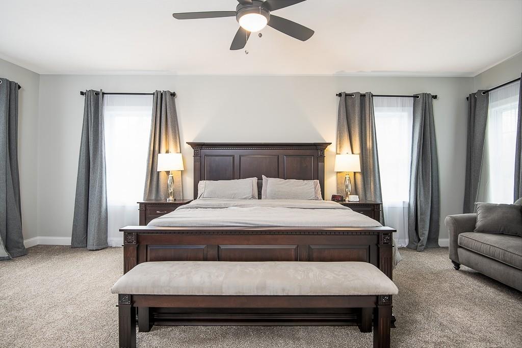 222 Sugar Road Bolton, MA 01740 - Photo 18 of 36 a bedroom with a bed and a couch