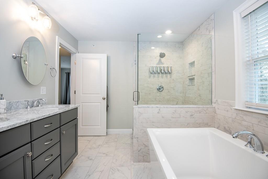 222 Sugar Road Bolton, MA 01740 - Photo 20 of 36 a bathroom with a tub sink and mirror