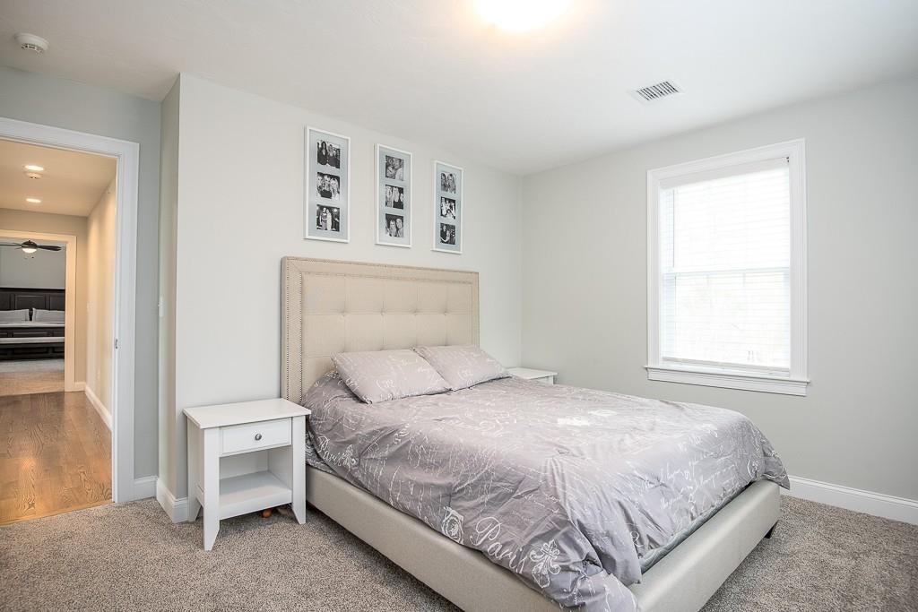 222 Sugar Road Bolton, MA 01740 - Photo 24 of 36 a bedroom with a bed and a window