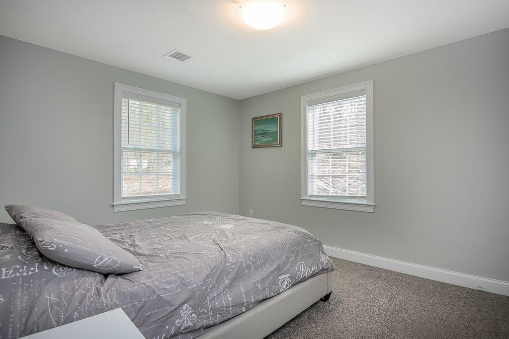 222 Sugar Road Bolton, MA 01740 - Photo 25 of 36 a bedroom with a bed and a window
