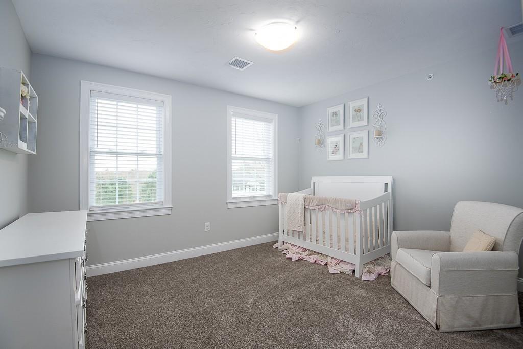222 Sugar Road Bolton, MA 01740 - Photo 27 of 36 a bedroom with furniture and a window