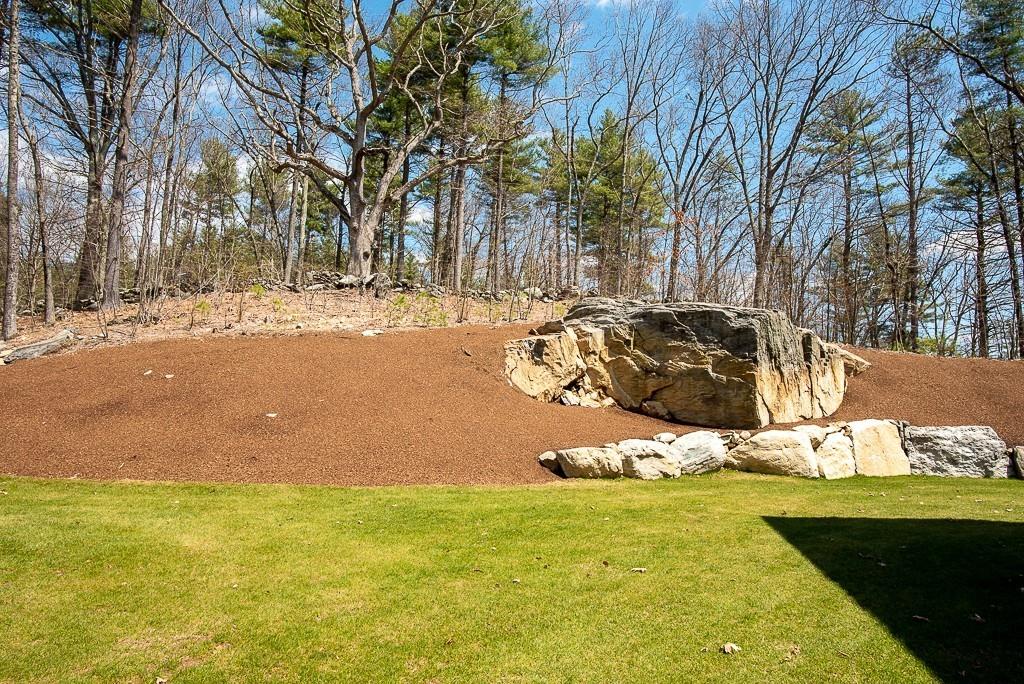 222 Sugar Road Bolton, MA 01740 - Photo 30 of 36 a view of a yard with an outdoor space