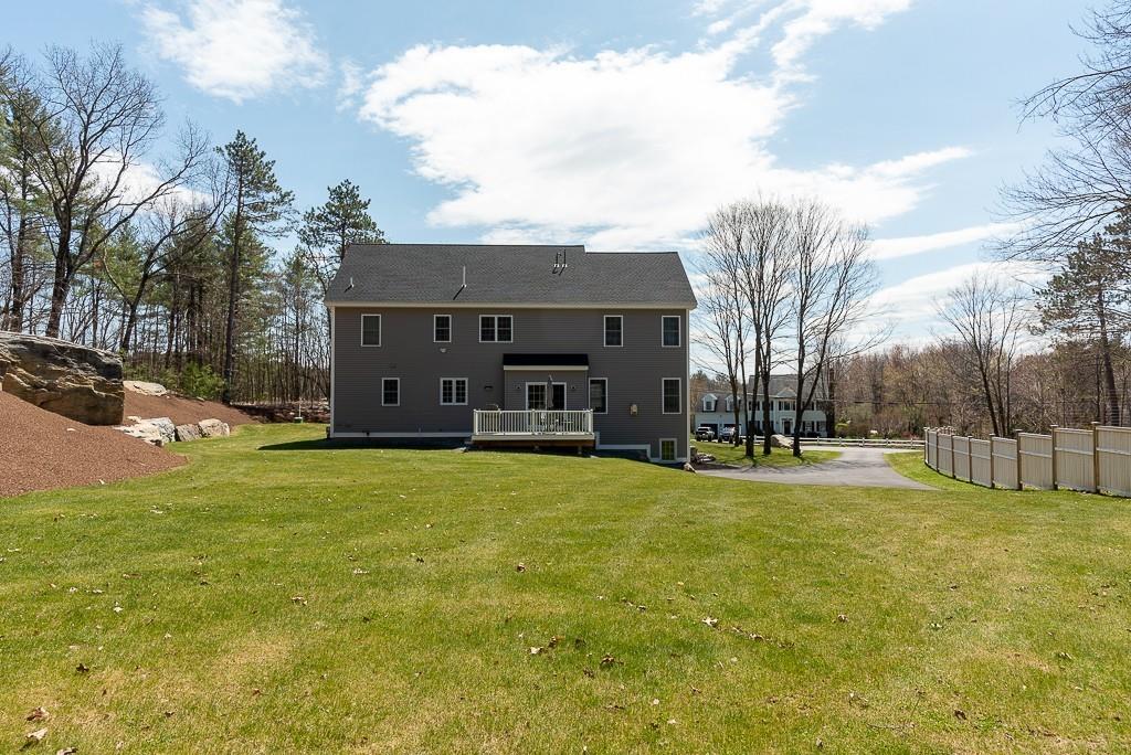 222 Sugar Road Bolton, MA 01740 - Photo 32 of 36 a view of a house with a big yard and large trees