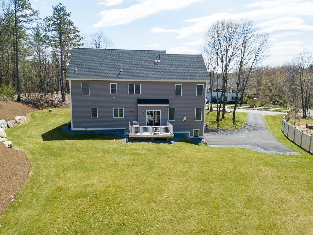 222 Sugar Road Bolton, MA 01740 - Photo 33 of 36 a front view of a house with a yard