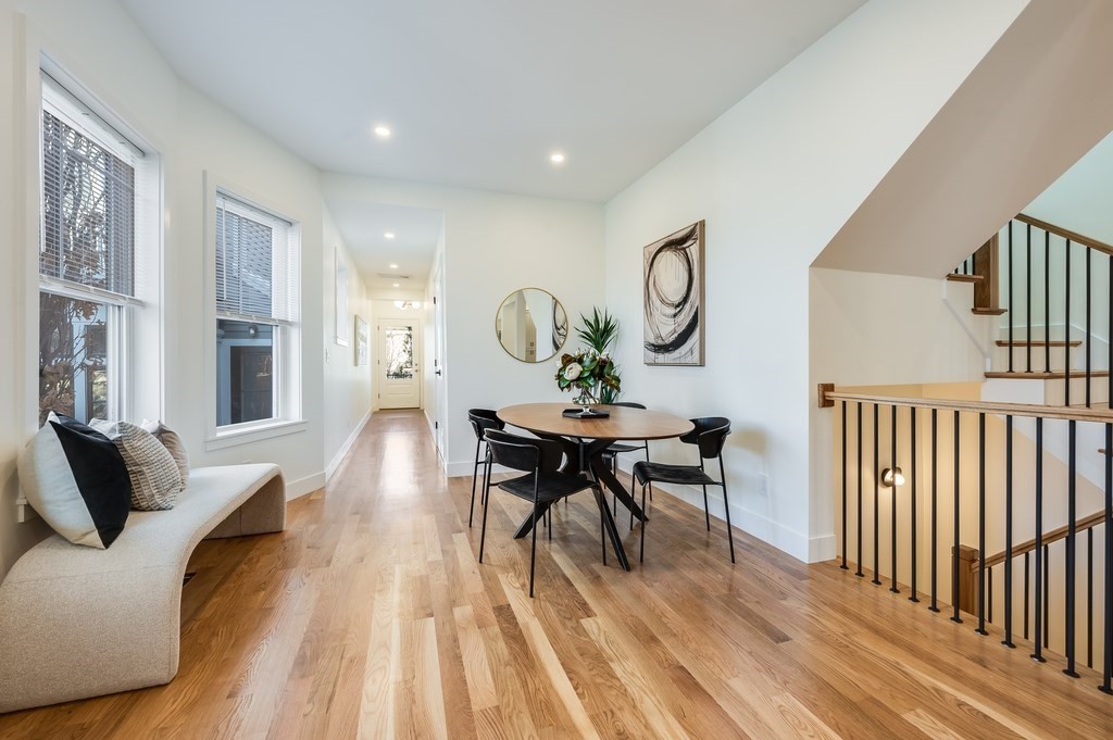 96 Otis Street, Unit 2 Cambridge, MA 02141 - Photo 15 of 42 a living room with furniture and a wooden floor
