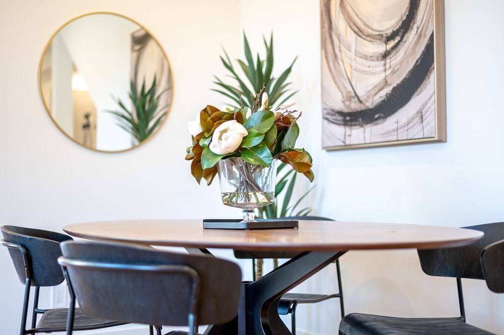 96 Otis Street, Unit 2 Cambridge, MA 02141 - Photo 17 of 42 a view of a dining room with furniture and wooden floor