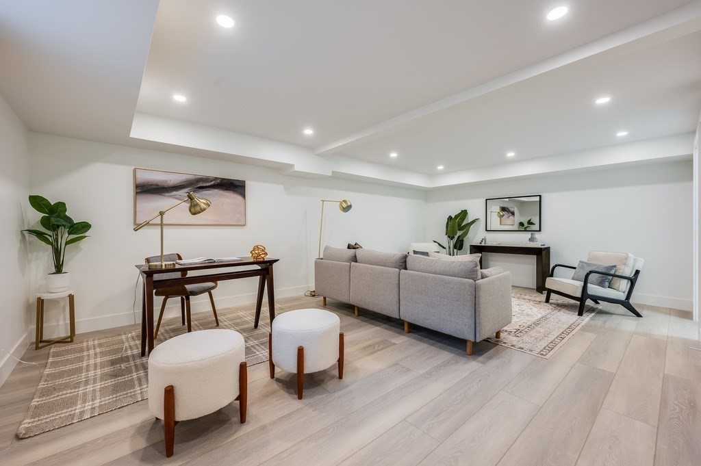 96 Otis Street, Unit 2 Cambridge, MA 02141 - Photo 32 of 42 a living room with furniture and a wooden floor