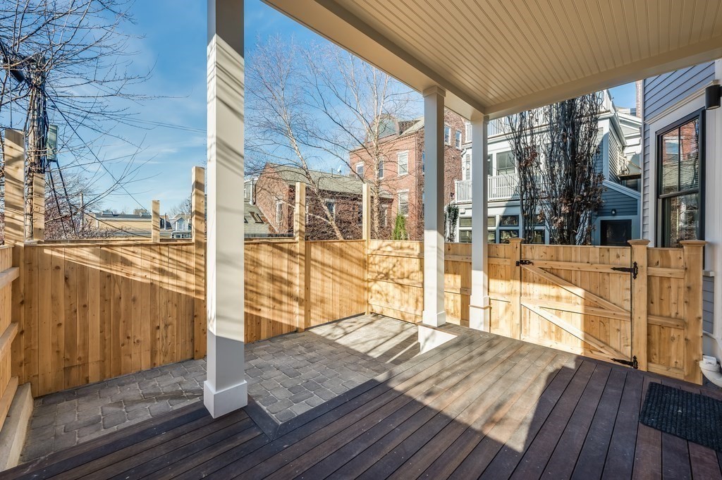 96 Otis Street, Unit 2 Cambridge, MA 02141 - Photo 39 of 42 a view of a balcony with wooden floor