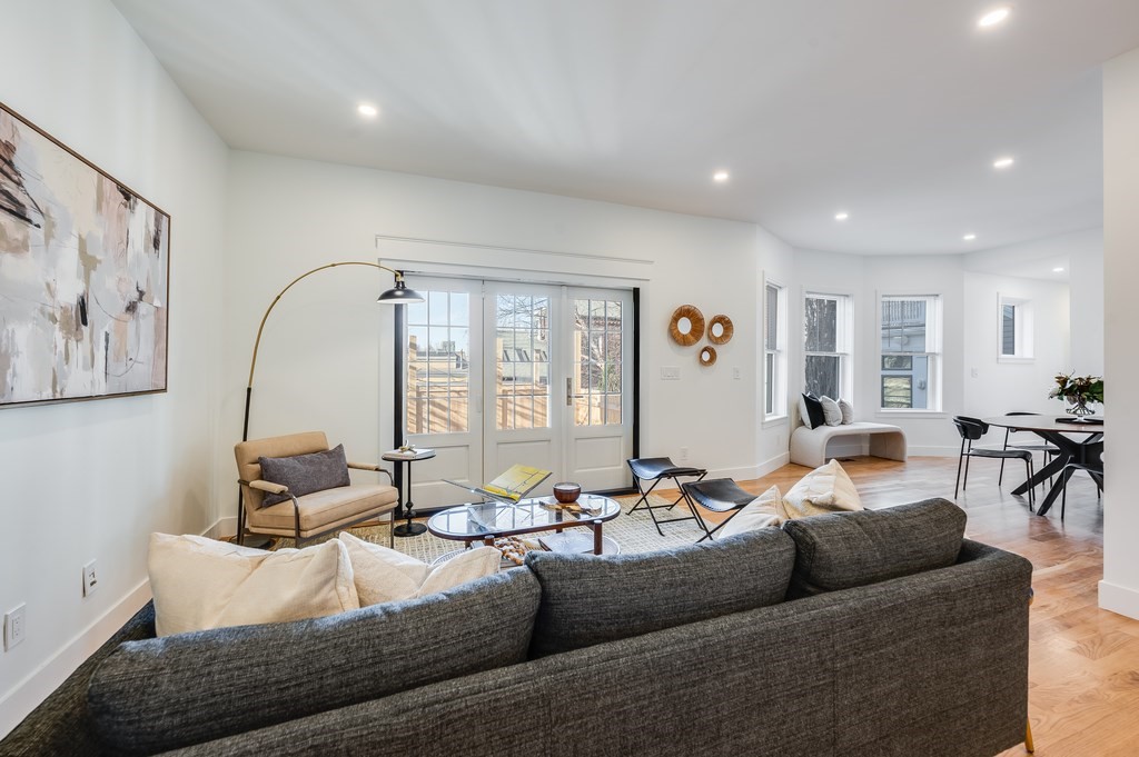 96 Otis Street, Unit 2 Cambridge, MA 02141 - Photo 4 of 42 a living room with furniture and a large window