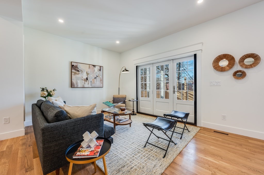 96 Otis Street, Unit 2 Cambridge, MA 02141 - Photo 5 of 42 a living room with furniture and wooden floor