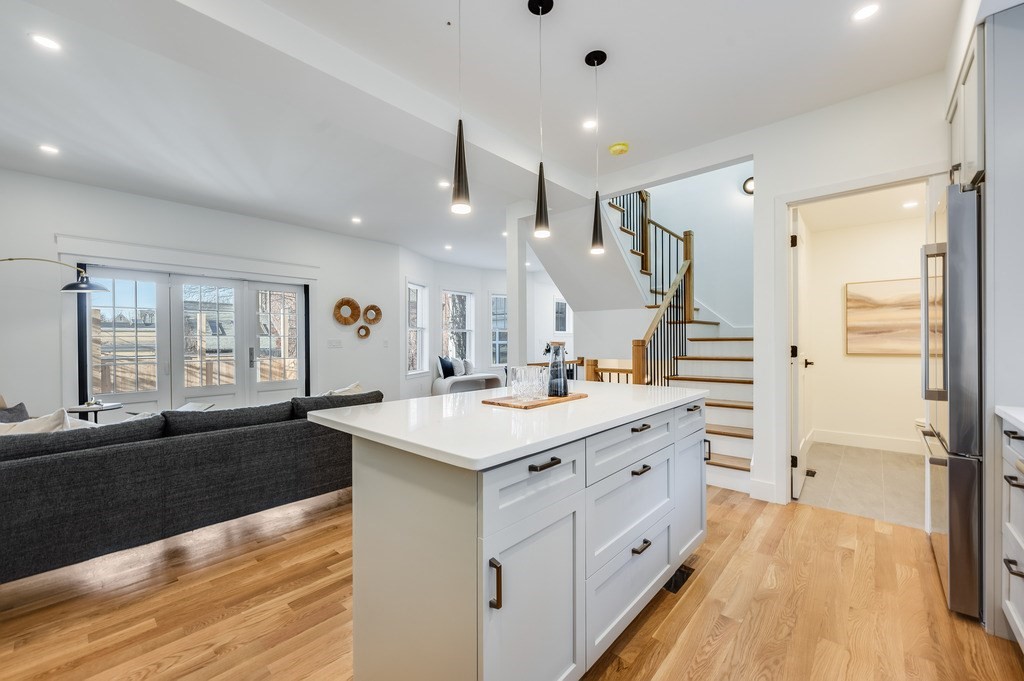 96 Otis Street, Unit 2 Cambridge, MA 02141 - Photo 8 of 42 a large white kitchen with a large window
