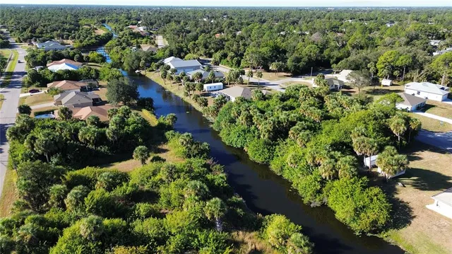 a view of a garden with lawn chairs