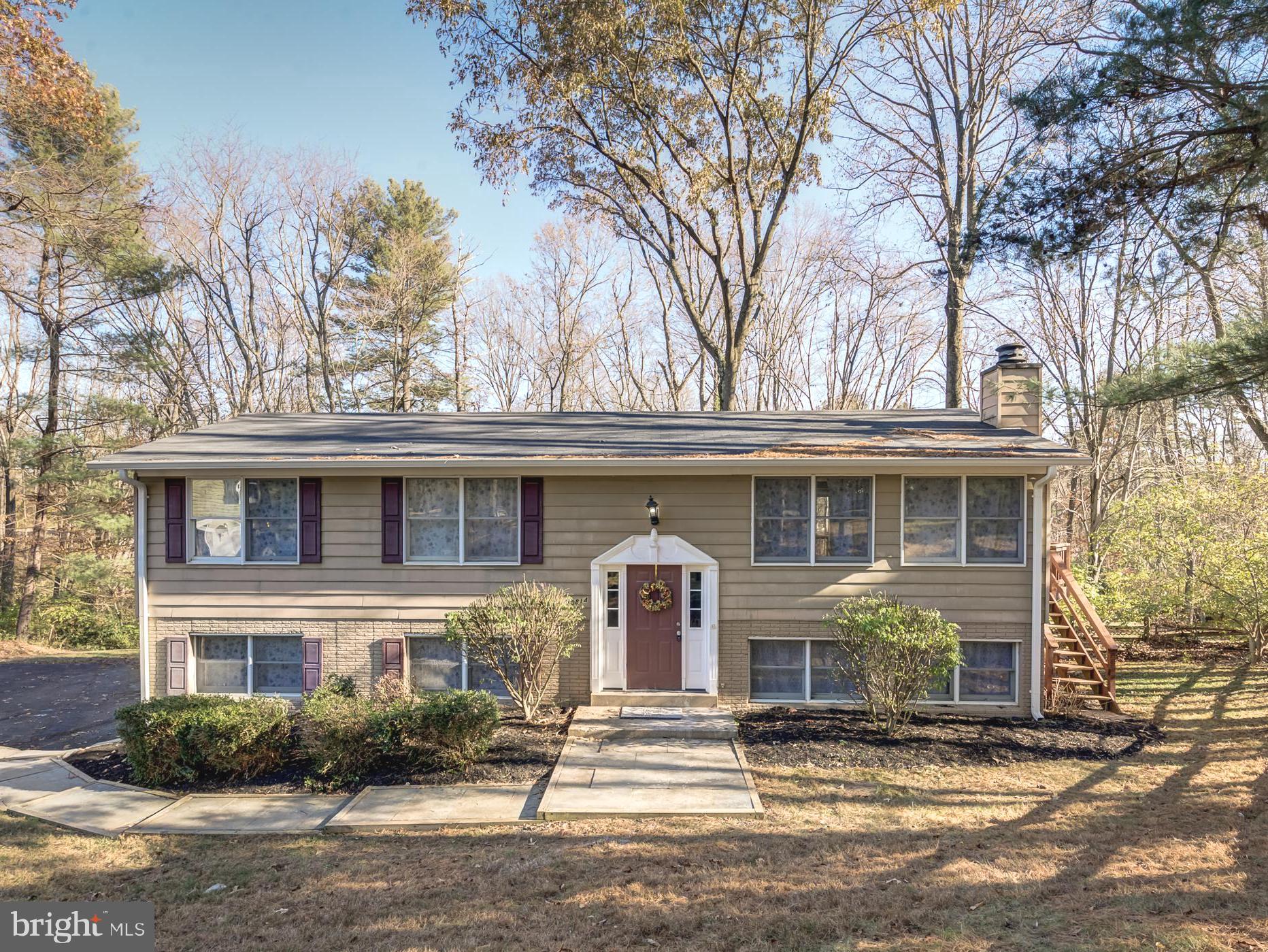10814 Oldfield Drive Reston, VA 20191 - Photo 1 of 77 a front view of a house with a yard