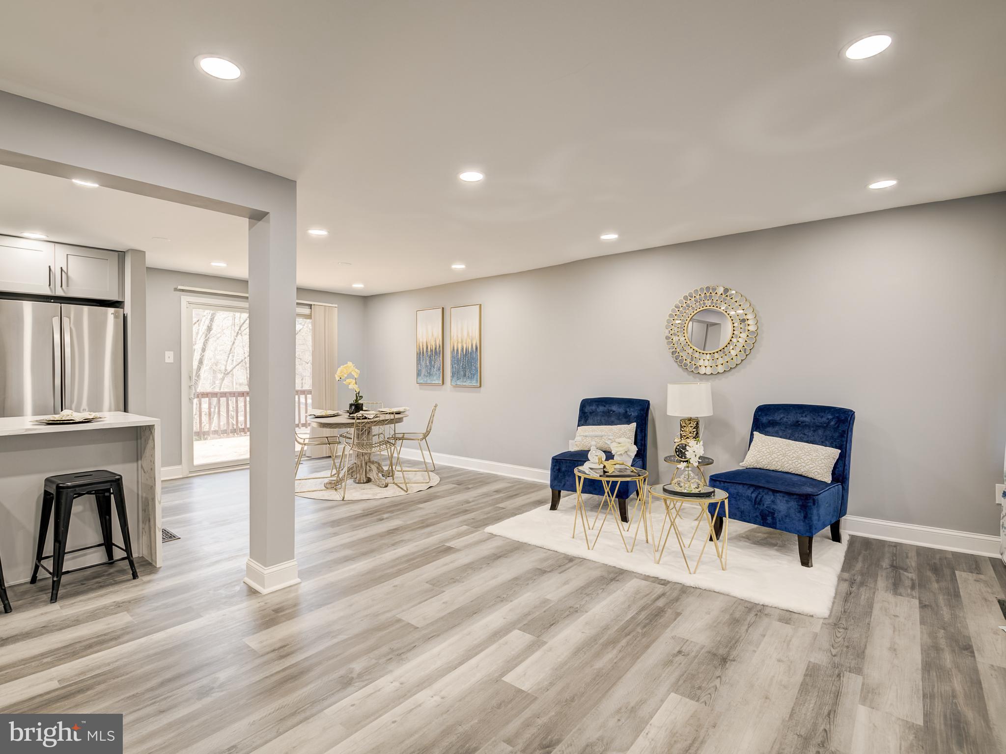 10814 Oldfield Drive Reston, VA 20191 - Photo 12 of 77 a living room with furniture and a table