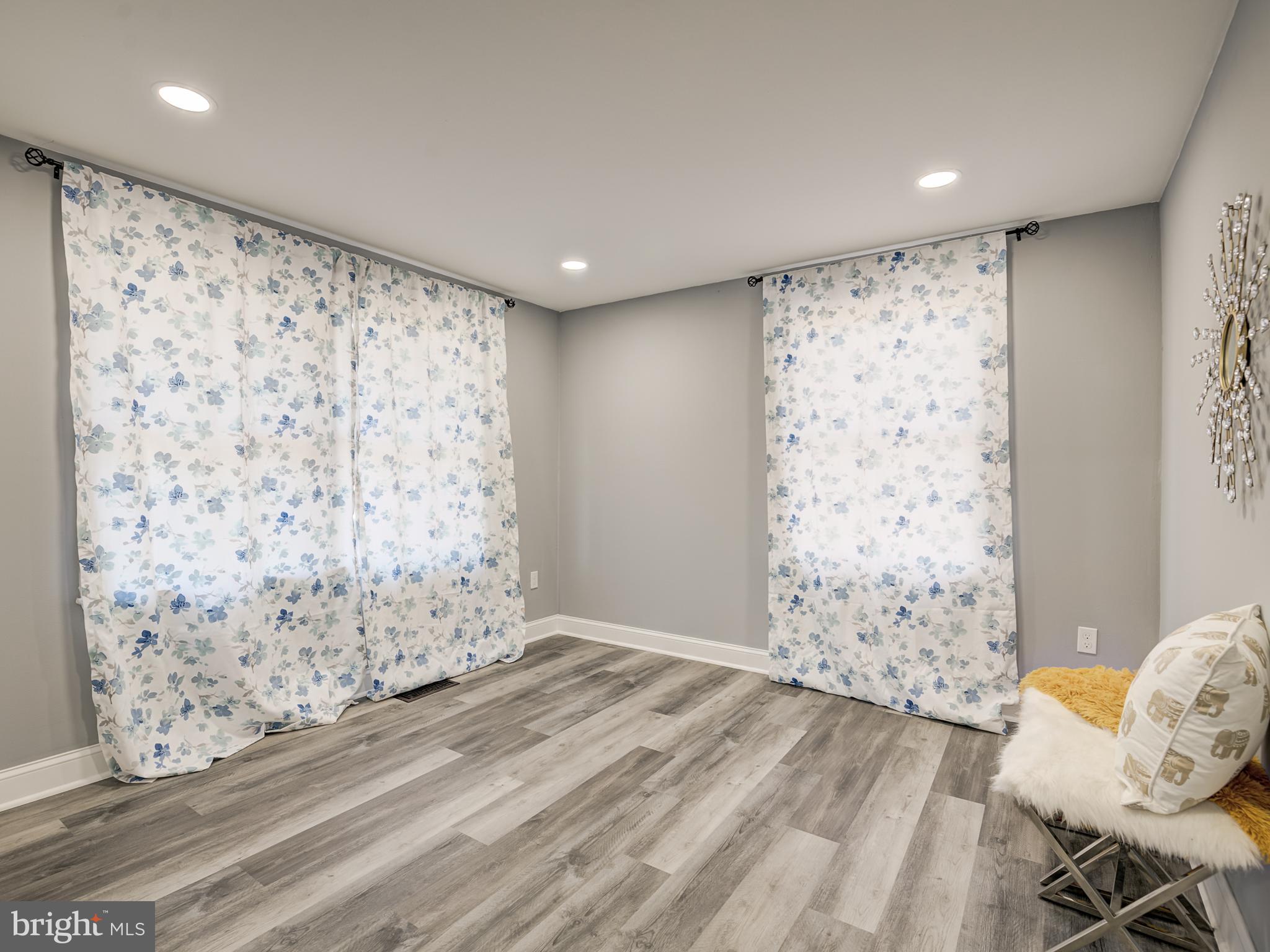 10814 Oldfield Drive Reston, VA 20191 - Photo 34 of 77 a view of a livingroom with wooden floor and a window