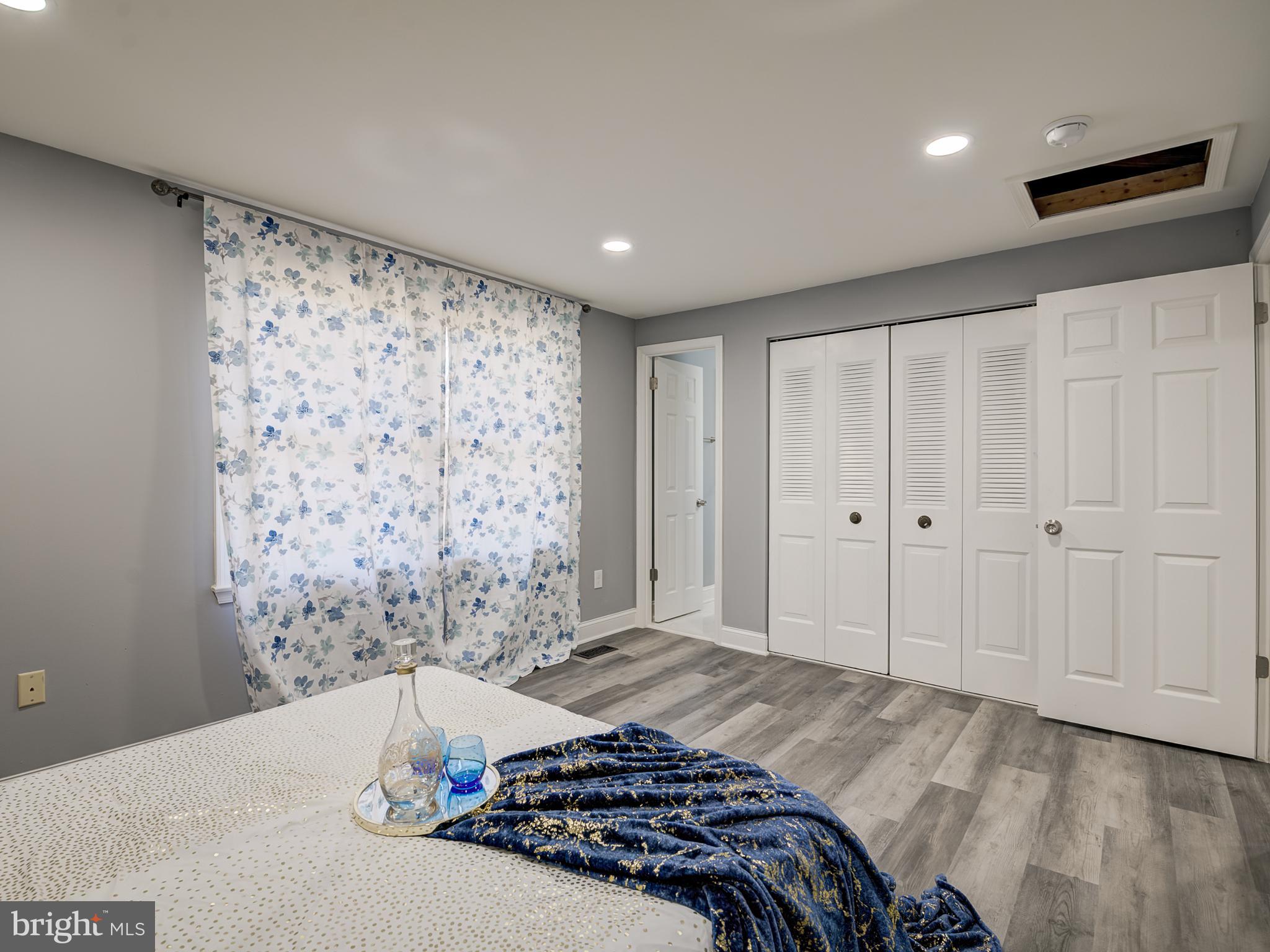 10814 Oldfield Drive Reston, VA 20191 - Photo 40 of 77 a bedroom with a bed and a shower curtain