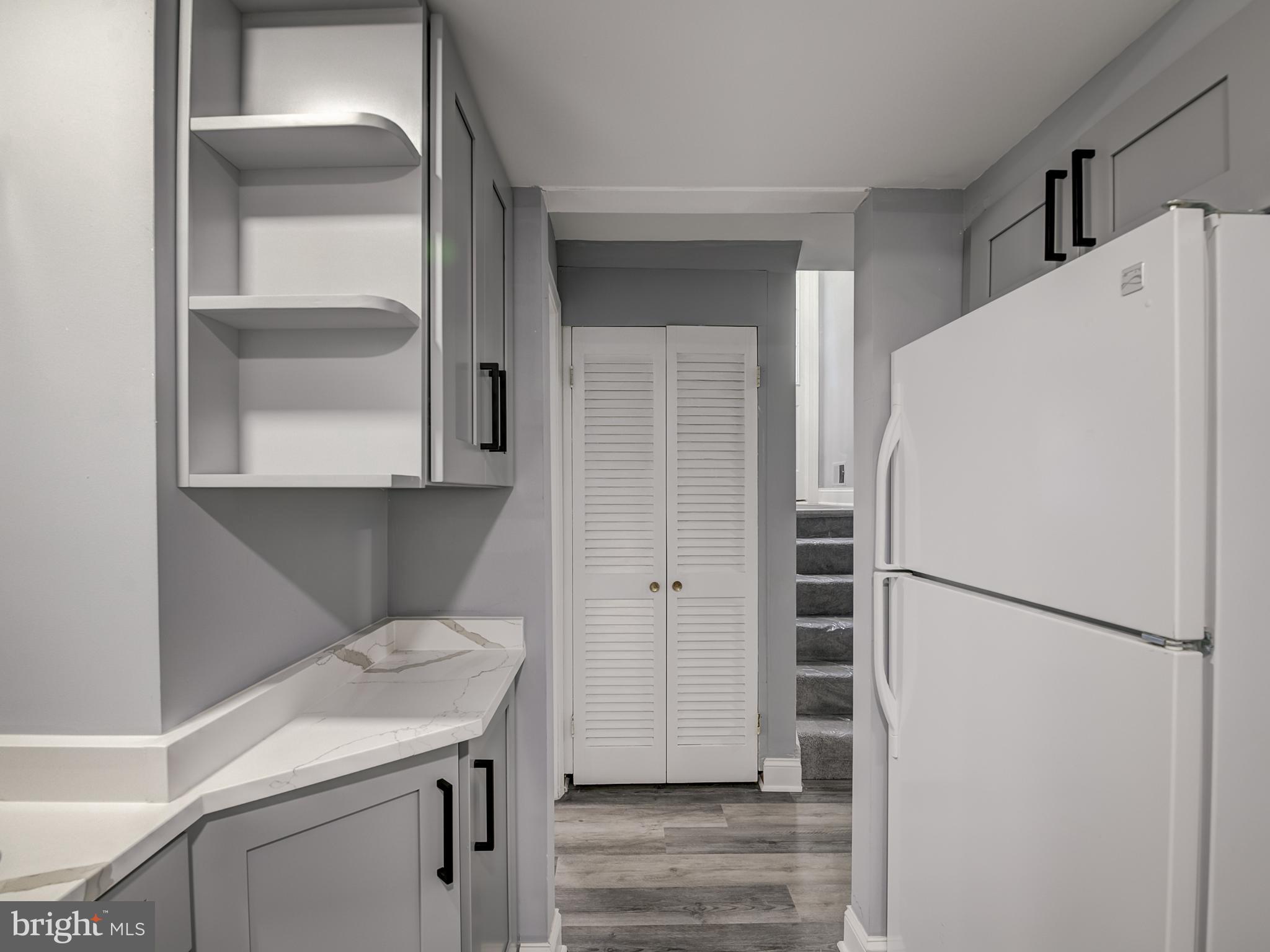 10814 Oldfield Drive Reston, VA 20191 - Photo 55 of 77 a white refrigerator freezer and a stove sitting inside of a kitchen