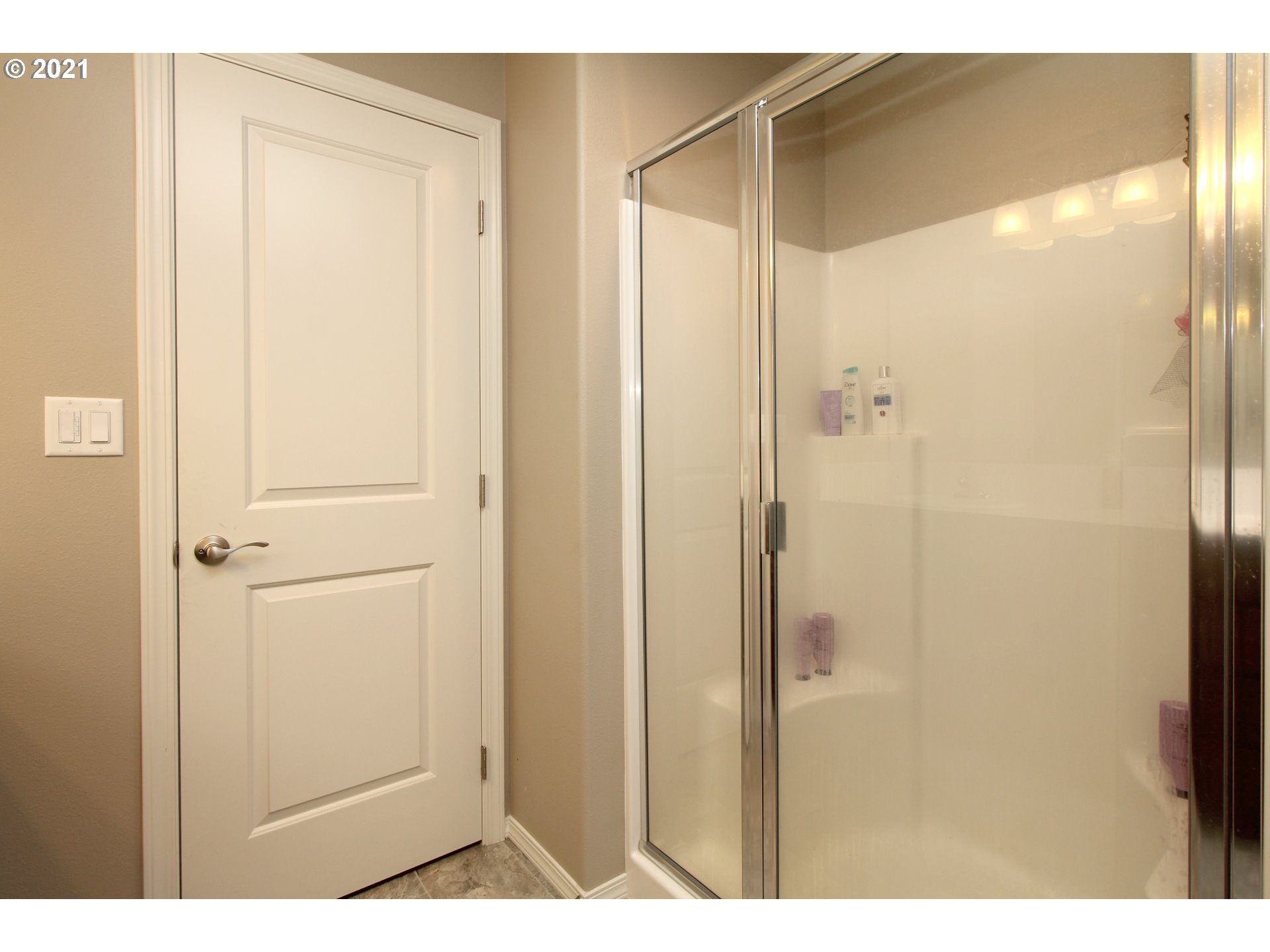 2041 South 59th Street Springfield, OR 97478 - Photo 19 of 31 a bathroom with a shower and a glass door