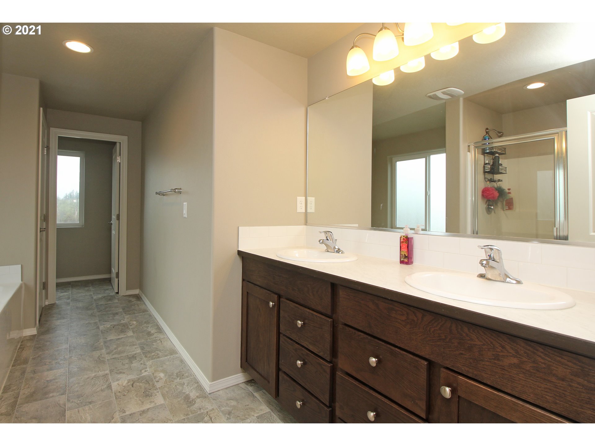 2041 South 59th Street Springfield, OR 97478 - Photo 20 of 31 a bathroom with a double vanity sink and a mirror