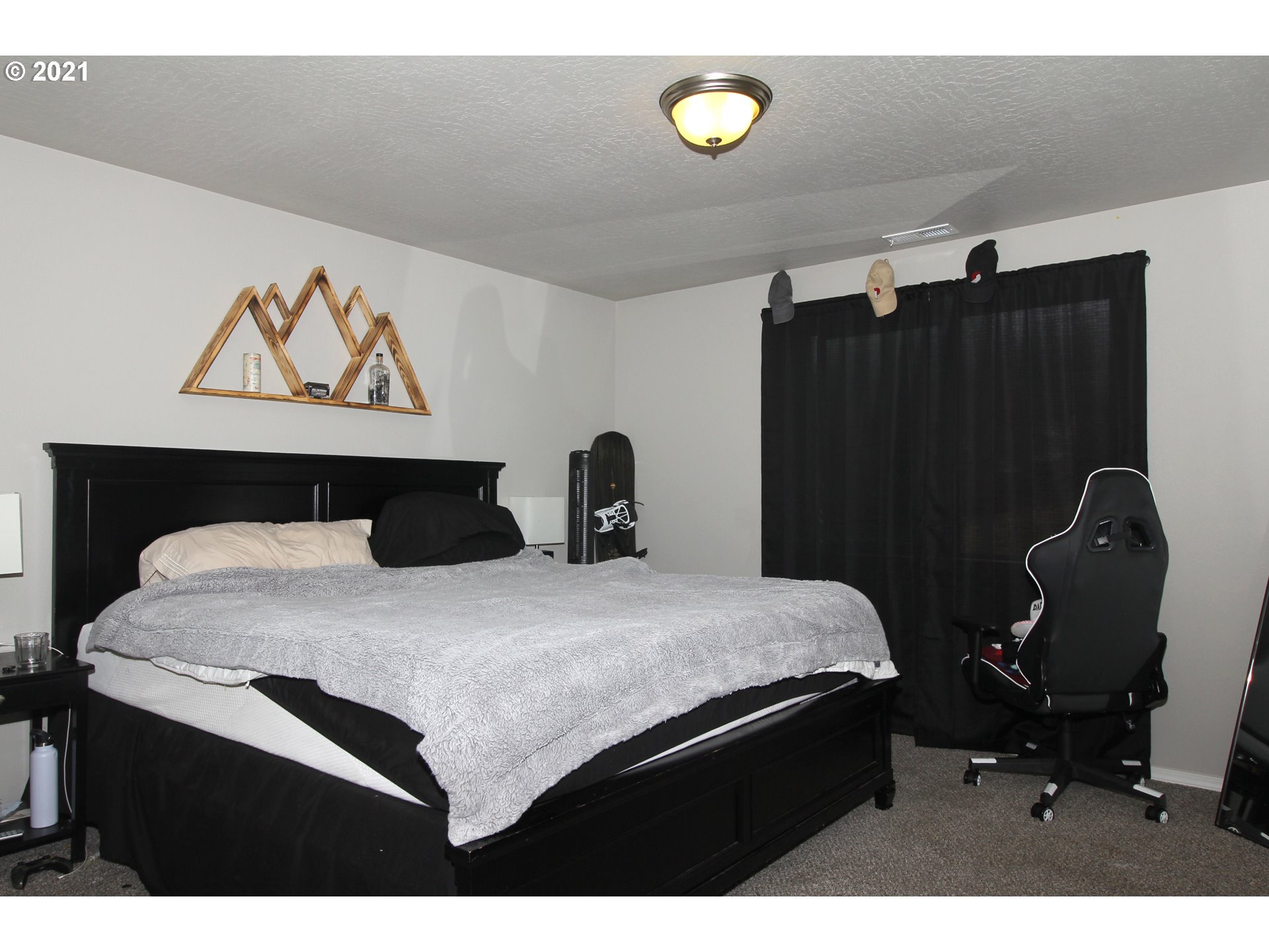 2041 South 59th Street Springfield, OR 97478 - Photo 21 of 31 a bedroom with a bed and cabinets