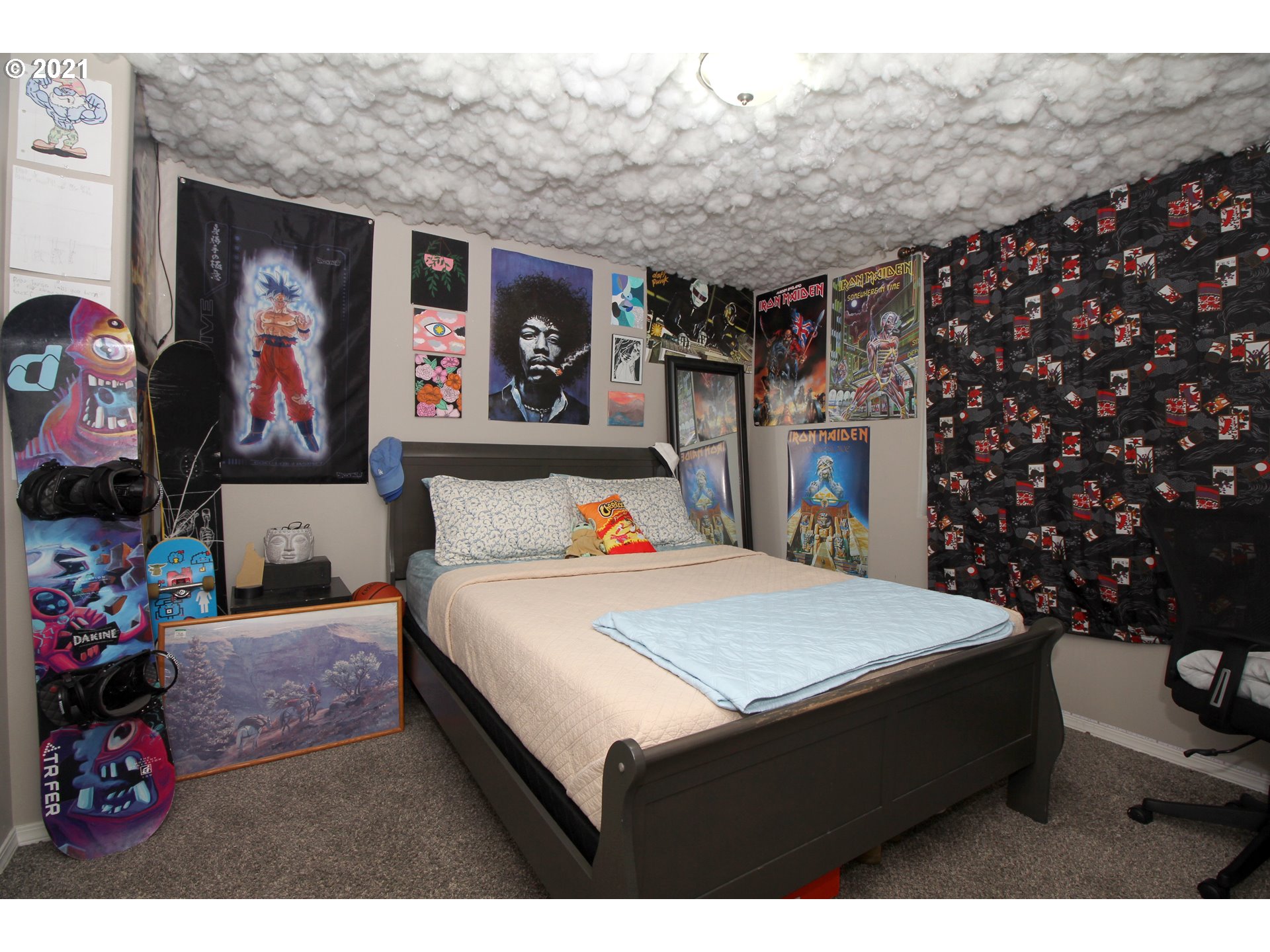 2041 South 59th Street Springfield, OR 97478 - Photo 23 of 31 a bedroom with a bed a wall painting and a potted plant