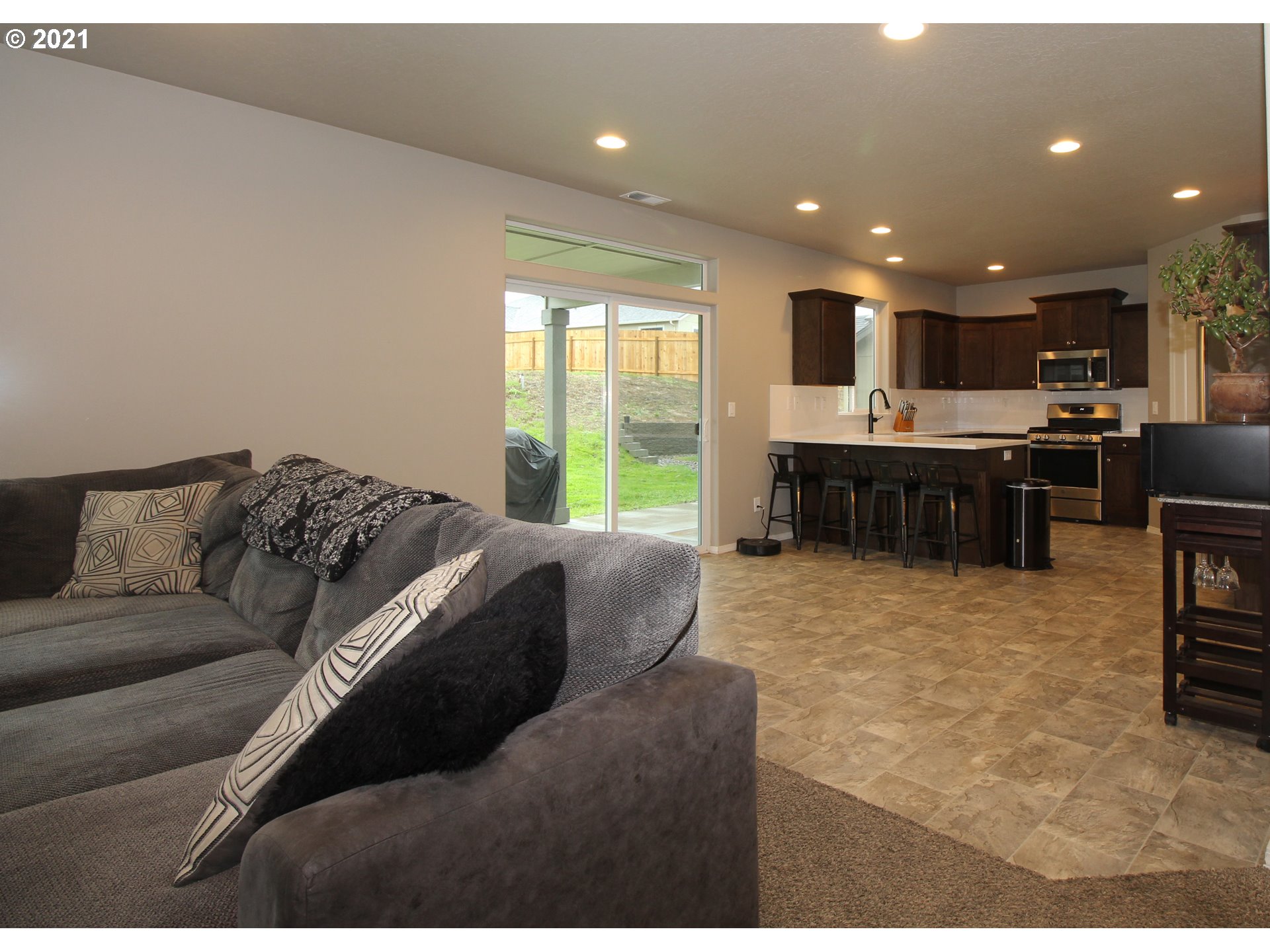 2041 South 59th Street Springfield, OR 97478 - Photo 7 of 31 a living room with furniture and a flat screen tv