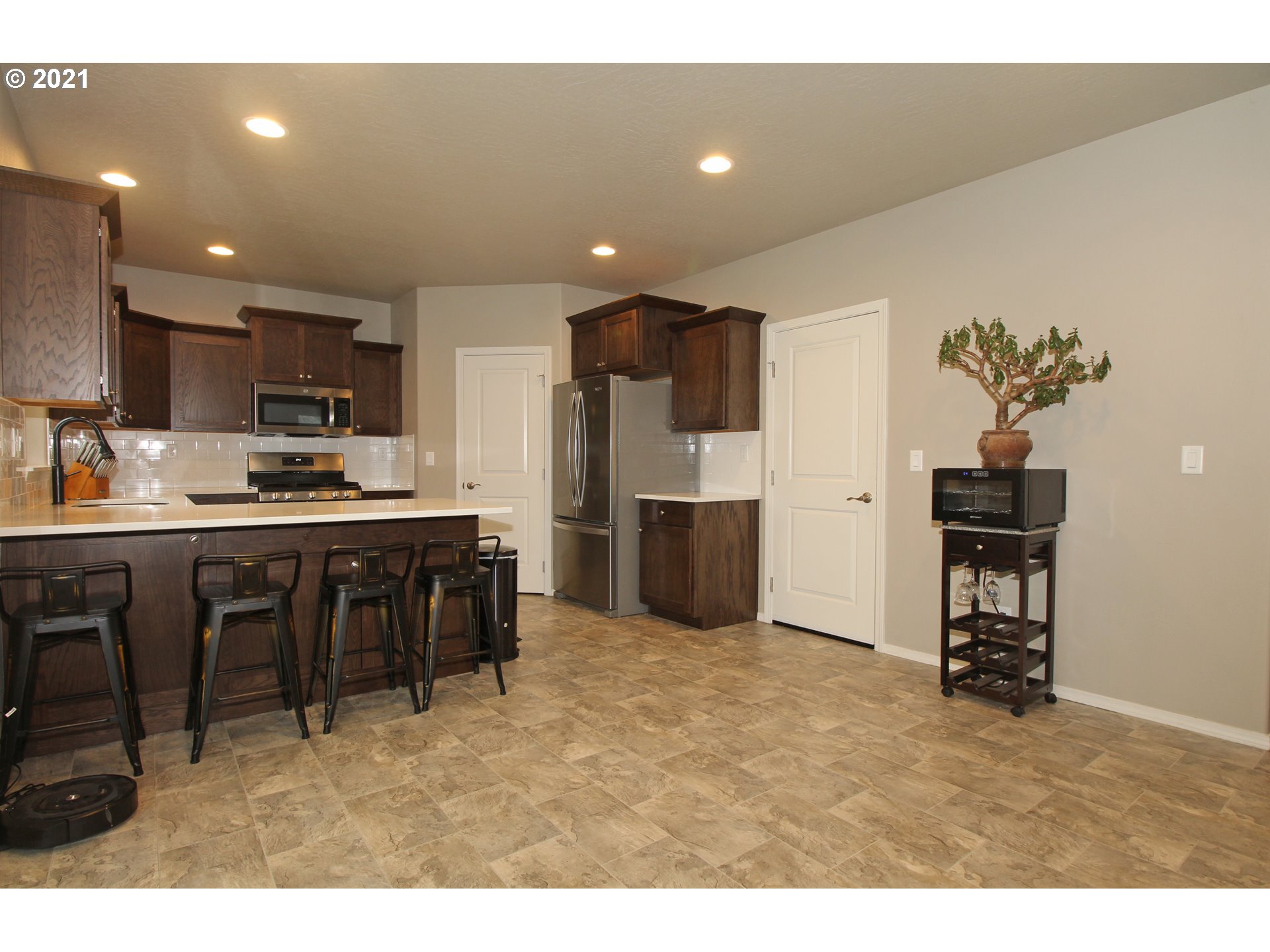 2041 South 59th Street Springfield, OR 97478 - Photo 8 of 31 a kitchen with refrigerator and cabinets
