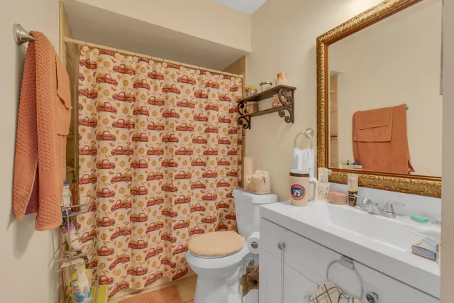 a bedroom with a bed and a chair